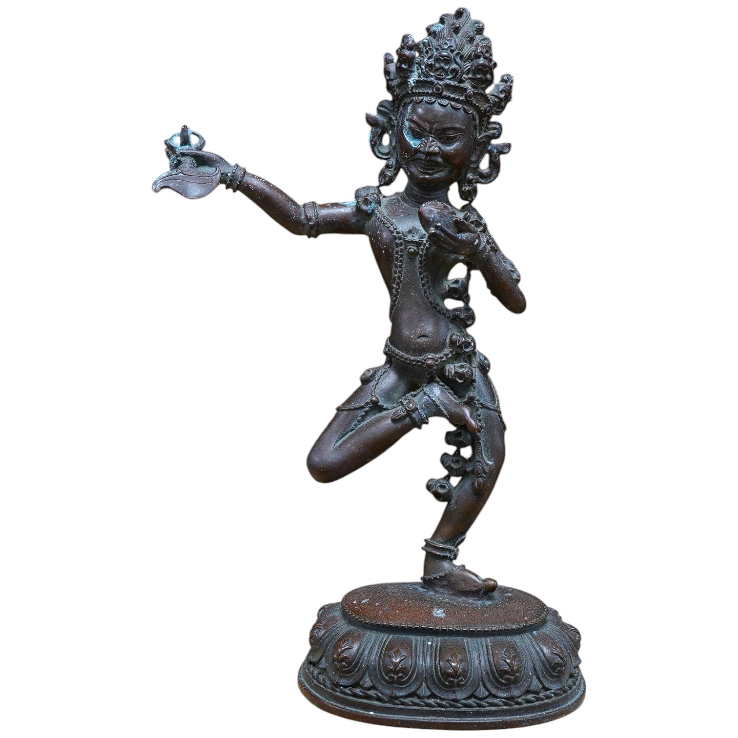 A bronze Tibetan dancing deity, 28.5cm high. Condition - fair to good